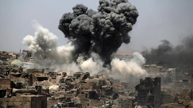 Smoke billowing following an airstrike by US-led international coalition forces targeting Islamic State (IS) group in Mosul. IS still controls swathes of western Iraq including much of the desert Anbar province and rival forces, which largely cooperated against the jihadists in Mosul, are expected to compete for a share of the spoils. (AHMAD AL-RUBAYE / AFP) Smoke billowing following an airstrike by US-led international coalition forces targeting Islamic State (IS) group in Mosul. IS still controls swathes of western Iraq including much of the desert Anbar province and rival forces, which largely cooperated against the jihadists in Mosul, are expected to compete for a share of the spoils. (AHMAD AL-RUBAYE / AFP)