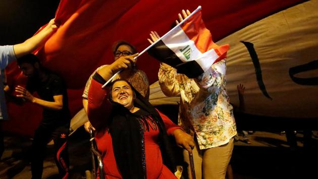 Iraqi people celebrate the liberation of the embattled city of Mosul in Baghdad. (Khalid al Mousily / REUTERS) Iraqi people celebrate the liberation of the embattled city of Mosul in Baghdad. (Khalid al Mousily / REUTERS)