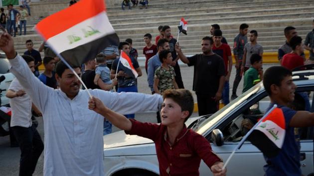 Children holding Iraq’s national flag react as Iraqi forces celebrate in the Old City of Mosul. (REUTERS) Children holding Iraq’s national flag react as Iraqi forces celebrate in the Old City of Mosul. (REUTERS)