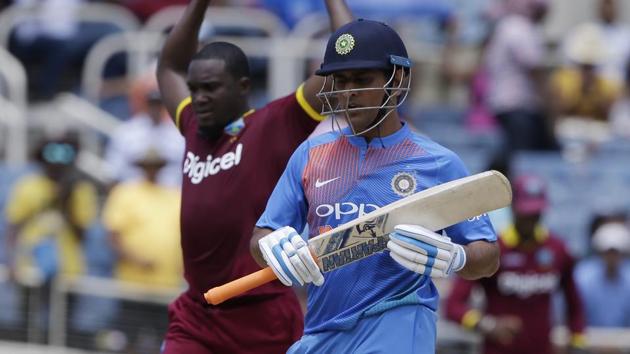 India's MS Dhoni leaves the field after being dismissed against West Indies during the T20I at Sabina Park in Kingston, Jamaica, on Sunday. (AP) India's MS Dhoni leaves the field after being dismissed against West Indies during the T20I at Sabina Park in Kingston, Jamaica, on Sunday. (AP)