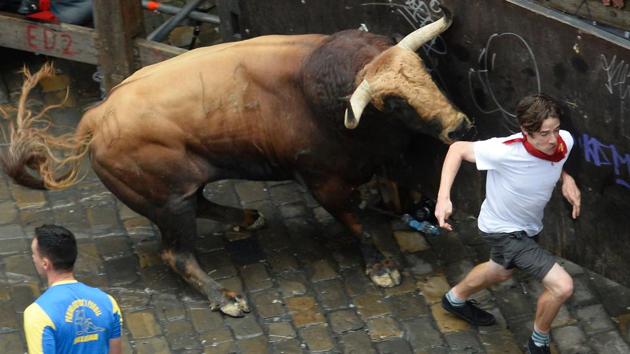 The runs start with the release of a rocket, after which the bulls are released onto the streets, and the ‘mozos’ or runners start running. (ANDER GILLENEA / AFP) The runs start with the release of a rocket, after which the bulls are released onto the streets, and the ‘mozos’ or runners start running. (ANDER GILLENEA / AFP)