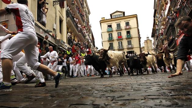 The San Fermin Festival attracts more than a million visitors to the city of Pamplona, in northern Spain, every year, from July 6 to 14. (Alvaro Barrientos / AP) The San Fermin Festival attracts more than a million visitors to the city of Pamplona, in northern Spain, every year, from July 6 to 14. (Alvaro Barrientos / AP)