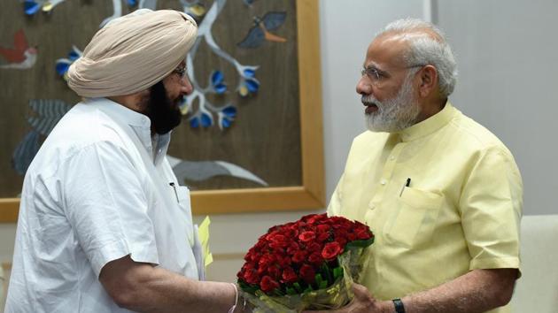 (Left) Punjab chief minister Captain Amarinder Singh and Prime Minsiter Narendra Modi.(HT File Photo)