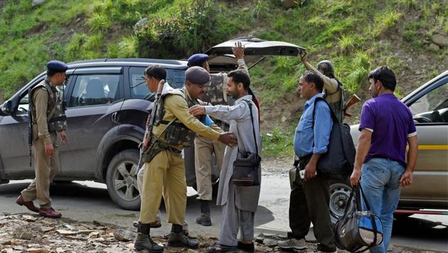 Security personnel frisking the yatris and the locals before they head towards the holy cave shrine following the militant attack on a bus at Nuwun base Camp in South Kashmir on Tuesday. (PTI Photo) Security personnel frisking the yatris and the locals before they head towards the holy cave shrine following the militant attack on a bus at Nuwun base Camp in South Kashmir on Tuesday. (PTI Photo)