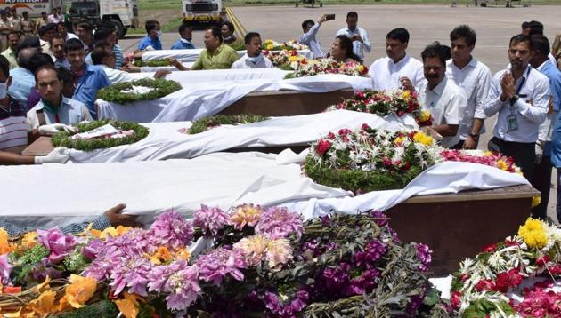 People pay tributes to the Amarnath pilgrims who were killed in Monday’s terrorist attack at Anantnag in Jammu and Kashmir after their bodies were brought in an IAF plane to the airport in Surat on Tuesday.(PTI) People pay tributes to the Amarnath pilgrims who were killed in Monday’s terrorist attack at Anantnag in Jammu and Kashmir after their bodies were brought in an IAF plane to the airport in Surat on Tuesday.(PTI)