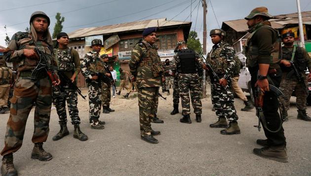 Security force personnel stand at the site of a gunbattle between police and militants on Monday in which seven pilgrims were killed, in Boateng village in south Kashmir's Anantnag district. (REUTERS) Security force personnel stand at the site of a gunbattle between police and militants on Monday in which seven pilgrims were killed, in Boateng village in south Kashmir's Anantnag district. (REUTERS)