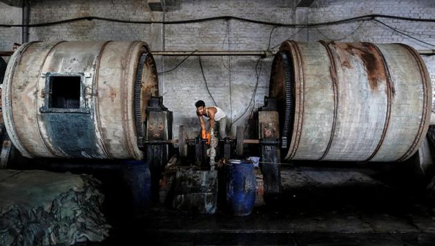 An employee works inside a leather tannery at an industrial area in Kanpur, Uttar Pradesh. (Danish Siddiqui / Reuters) An employee works inside a leather tannery at an industrial area in Kanpur, Uttar Pradesh. (Danish Siddiqui / Reuters)
