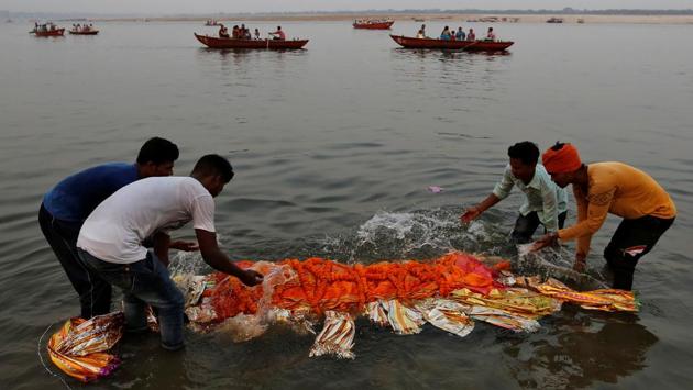 Relatives immerse a body in the river Ganga prior to cremation in Varanasi, Uttar Pradesh. Countless Hindu devotees come to the ancient holy city and cremate the dead, immersing their ashes into the ghats along the banks in hope of salvation. During major festivals offerings and the residual waste generated add to the human impact on the Ganga. Widely held beliefs of bathing and drinking the water from the river pose health risks in such circumstances. (Danish Siddiqui / Reuters) Relatives immerse a body in the river Ganga prior to cremation in Varanasi, Uttar Pradesh. Countless Hindu devotees come to the ancient holy city and cremate the dead, immersing their ashes into the ghats along the banks in hope of salvation. During major festivals offerings and the residual waste generated add to the human impact on the Ganga. Widely held beliefs of bathing and drinking the water from the river pose health risks in such circumstances. (Danish Siddiqui / Reuters)