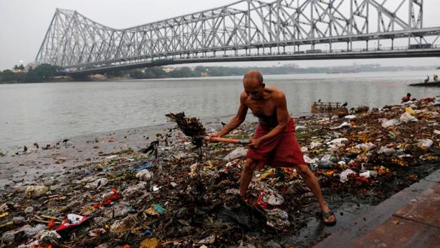 Garbage is cleaned along the banks of the river Ganga in Kolkata, West Bengal. From its pristine waters in the Devprayag region to the final mixing of littered and polluted water emptying into the Bay of Bengal, the transformation that occurs in the quality of the water is apparent. (Danish Siddiqui / Reuters) Garbage is cleaned along the banks of the river Ganga in Kolkata, West Bengal. From its pristine waters in the Devprayag region to the final mixing of littered and polluted water emptying into the Bay of Bengal, the transformation that occurs in the quality of the water is apparent. (Danish Siddiqui / Reuters)