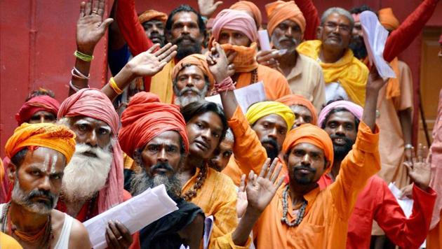 Sadhus wait to register themselves for the Amarnath pilgrimage at a base camp in Jammu on Friday. (PTI photo) Sadhus wait to register themselves for the Amarnath pilgrimage at a base camp in Jammu on Friday. (PTI photo)