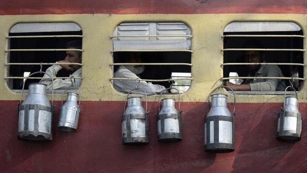 Indian milkmen in Punjab take the public trains each day to transport dairy products from farms to the villages surrounding Jalandhar. (AFP) Indian milkmen in Punjab take the public trains each day to transport dairy products from farms to the villages surrounding Jalandhar. (AFP)