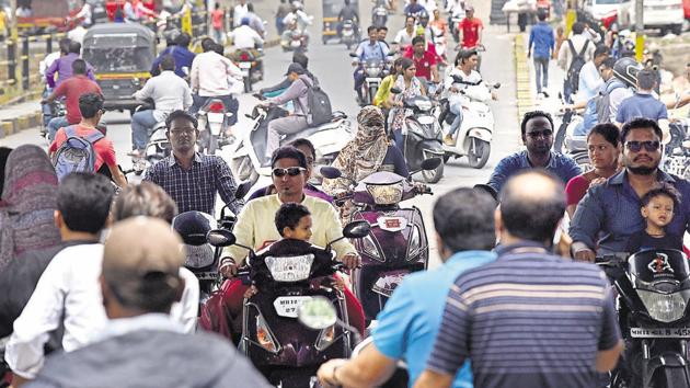 Two wheeler riders not wearing helmets and blatantly ignoring traffic rules is a common sight in Pune. (Pratham Gokhale/HT PHOTO) Two wheeler riders not wearing helmets and blatantly ignoring traffic rules is a common sight in Pune. (Pratham Gokhale/HT PHOTO)