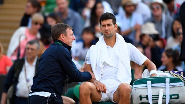 Three-time Wimbledon champion Novak Djokovic retired injured during his quarter-final against Czech Tomas Berdych. He appeared to be struggling with an arm injury. (Twitter )