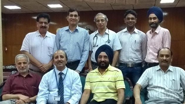 A team of doctors who performed the organ transplant, along with PGIMER director Dr Jagat Ram (sitting second from left), in Chandigarh on Tuesday.(HT Photo)