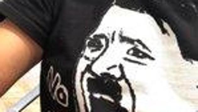 A black T-shirt with a cartoon of Adolf Hitler was worn by Japanese entrepreneur Takafumi Horie.(Twitter/ Takafumi Horie)