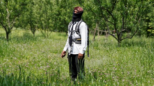 A stone pelter poses in an orchard near Srinagar. Human rights groups have urged India to renounce their use of pellet guns, calling it a violation of the UN’s principles of restraint. (Cathal McNaughton / Reuters)