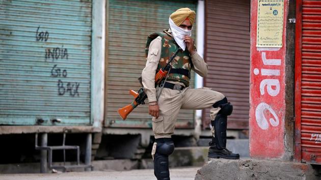 Pro-independence graffiti is sprayed on a shop shutter during curfew in Srinagar, India. In recent times, militant gunmen have killed police officers in their own homes in a wave of fatal attacks. Some protesters are not only against Indian administration of the region, but also against their parents. Each wave of street protests – the last major incidents in 2008 and 2010 – radicalized a new wave of young people in the valley. (Cathal McNaughton / Reuters)