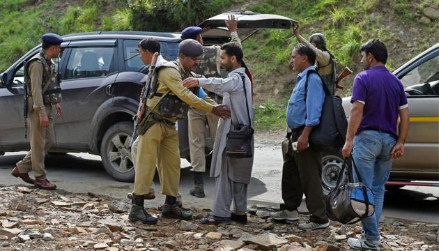 Nuwan Base Camp: Security personnel frisking the yatris and the locals before they head towards the holy cave shrine following the militant attack on a bus in which seven pilgrims were killed and 19 others injured.(PTI)