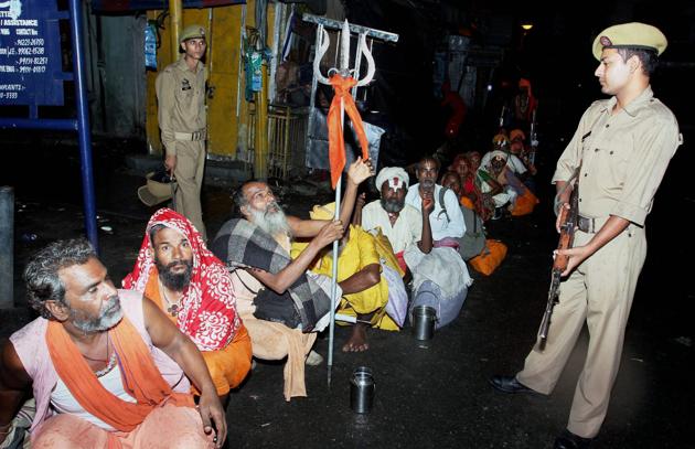 Security personnel stand guard as sadhus gather to head towards Kashmir to pay obeisance at the Amarnath shrine cave in Jammu. (PTI File Photo) Security personnel stand guard as sadhus gather to head towards Kashmir to pay obeisance at the Amarnath shrine cave in Jammu. (PTI File Photo)