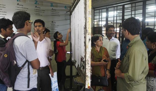 Students check a merit list at a city college.(HT file)