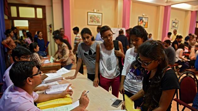 Children collecting admission from at KC college in Mumbai, India, on Tuesday, July 11.(Satyabrata Tripathy/HT Photo)
