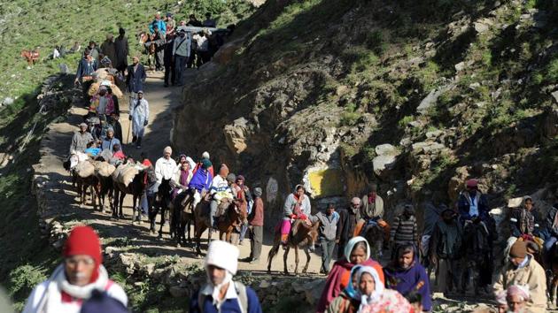 Pilgrims begin their journey from Baltal base camp to the Amarnath cave shrine. Seven people were killed when terrorists attacked a bus carrying pilgrims on Monday night in Jammu and Kashmir’s Anantnag district.(AFP file photo) Pilgrims begin their journey from Baltal base camp to the Amarnath cave shrine. Seven people were killed when terrorists attacked a bus carrying pilgrims on Monday night in Jammu and Kashmir’s Anantnag district.(AFP file photo)