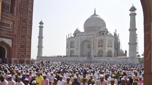 The Taj Mahal seen in the backdrop as a congregation offers Eid prayers in Agra, Uttar Pradesh. The 16th-century monument draws millions of tourists from across the globe and earns the government crores in revenue annually. (Pawan Sharma / AP) The Taj Mahal seen in the backdrop as a congregation offers Eid prayers in Agra, Uttar Pradesh. The 16th-century monument draws millions of tourists from across the globe and earns the government crores in revenue annually. (Pawan Sharma / AP)