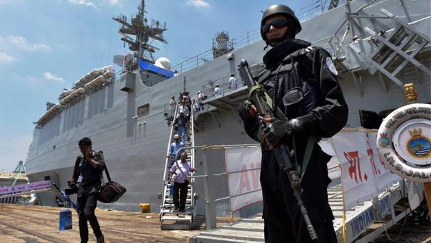 An Indian Navy commandant maintains vigil aboard INS Shivalik. The ashore leg of the exercises will take place in Chennai, covering exchanges on carrier strike group operations, maritime patrol and reconnaissance operations, surface and anti-submarine warfare, explosive ordnance disposal (EOD) and visit, board, search and seizure (VBSS) operations. (R Senthil Kumar / PTI) An Indian Navy commandant maintains vigil aboard INS Shivalik. The ashore leg of the exercises will take place in Chennai, covering exchanges on carrier strike group operations, maritime patrol and reconnaissance operations, surface and anti-submarine warfare, explosive ordnance disposal (EOD) and visit, board, search and seizure (VBSS) operations. (R Senthil Kumar / PTI)