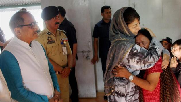 Jammu and Kashmir chief minister Mehbooba Mufti consoles an Amarnath pilgrim who survived the Anantnag terror attack at the airport in Srinagar on Tuesday.(PTI File)