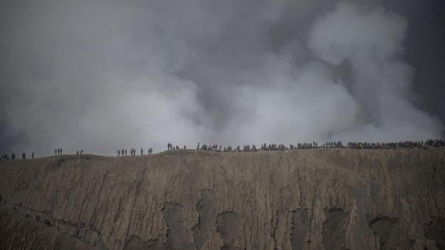 After settling, the Princess Roro Anteng and her husband Joko Seger  were unable to have children. They prayed to the mountain gods, who blessed them with 24 children, but demanded the 25th child be thrown into the volcano as a sacrifice. They complied and so began the annual sacrificial tradition. (JUNI KRISWANTO / AFP) 