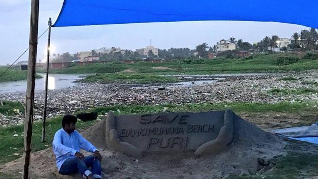 The sand artist Sudarsan Patnaik sitting on a hunger strike to protest against beach pollution at Bankimuhan. (Twitter/ Sudarsan Pattnaik) The sand artist Sudarsan Patnaik sitting on a hunger strike to protest against beach pollution at Bankimuhan. (Twitter/ Sudarsan Pattnaik)