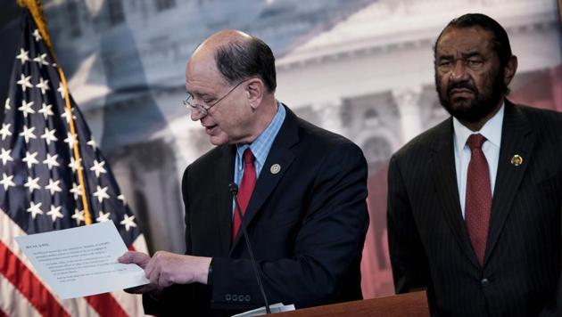 Brad Sherman (left) and Al Green take questions about articles of impeachment against US President Donald Trump at a press conference in Washington. (AFP) Brad Sherman (left) and Al Green take questions about articles of impeachment against US President Donald Trump at a press conference in Washington. (AFP)