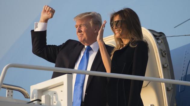 US President Donald Trump and First Lady Melania Trump board Air Force One prior to departure from Andrews Air Force Base in Maryland as they travel to Paris, France. (AFP Photo) US President Donald Trump and First Lady Melania Trump board Air Force One prior to departure from Andrews Air Force Base in Maryland as they travel to Paris, France. (AFP Photo)
