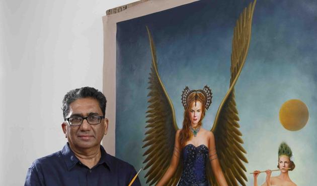 Artist Raghu Vyas with his painting of actor Nicole Kidman that he decided to paint after seeing Moulin Rouge! Artist Raghu Vyas with his painting of actor Nicole Kidman that he decided to paint after seeing Moulin Rouge!