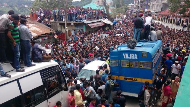 Large crowd gathered at Theog, 35 kms from Shimla, where the police had to produce in court the six accused arrested in rape-murder case on Friday. (HT Photo) Large crowd gathered at Theog, 35 kms from Shimla, where the police had to produce in court the six accused arrested in rape-murder case on Friday. (HT Photo)