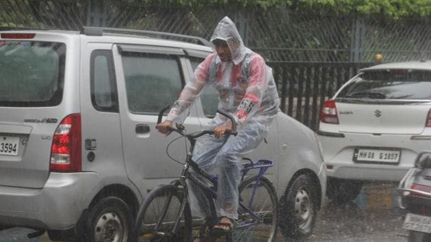 A man braves the rain in Mumbai on Friday. (Praful Gangurde) A man braves the rain in Mumbai on Friday. (Praful Gangurde)