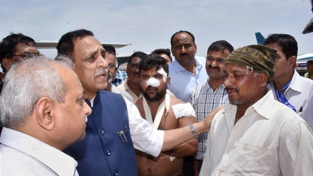 Gujarat Chief Minister Vijay Rupani and his deputy Nitin Patel with Salim Sheikh, the driver of the bus attacked by militants in Jammu and Kashmir.(PTI) Gujarat Chief Minister Vijay Rupani and his deputy Nitin Patel with Salim Sheikh, the driver of the bus attacked by militants in Jammu and Kashmir.(PTI)