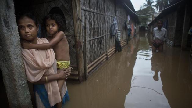 The survey released Friday by the Manila-based lender paints a grim outlook for many communities in Asia, home to about 4 billion people. It's based on the latest scientific research, with or without more aggressive efforts to curb carbon emissions that contribute to global warming. (Anupam Nath / AP )
