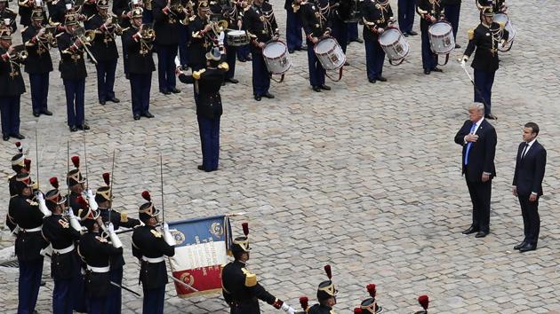 Emmanuel Macron and Donald Trump attend a welcoming ceremony and inspection of the guards at the Les Invalides in Paris, France. Trump appeared enthused by the military display, having described himself on an earlier occasion as a ‘big military person’. (Matthieu Alexandre / AP) Emmanuel Macron and Donald Trump attend a welcoming ceremony and inspection of the guards at the Les Invalides in Paris, France. Trump appeared enthused by the military display, having described himself on an earlier occasion as a ‘big military person’. (Matthieu Alexandre / AP)
