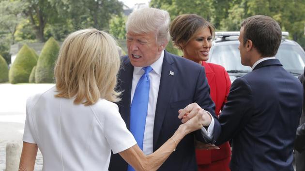 Trump’s interaction with the Macron’s wife Brigitte (L), however had the US president true to form as he took her hand, pulling it firmly towards himself and not letting go for some time, causing a bit of an awkward situation. Macron and Melania, appeared in the background more amiably. (Michel Euler / AP) Trump’s interaction with the Macron’s wife Brigitte (L), however had the US president true to form as he took her hand, pulling it firmly towards himself and not letting go for some time, causing a bit of an awkward situation. Macron and Melania, appeared in the background more amiably. (Michel Euler / AP)
