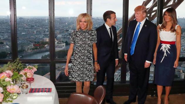 (French President Emmanuel Macron (2nd L), his wife Brigitte Macron (L), US President Donald Trump (2nd R) and his wife Melania Trump (R) arrive ahead of a dinner at Le Jules Verne Restaurant on the Eiffel Tower in Paris, on Thursday. (AFP) (French President Emmanuel Macron (2nd L), his wife Brigitte Macron (L), US President Donald Trump (2nd R) and his wife Melania Trump (R) arrive ahead of a dinner at Le Jules Verne Restaurant on the Eiffel Tower in Paris, on Thursday. (AFP)