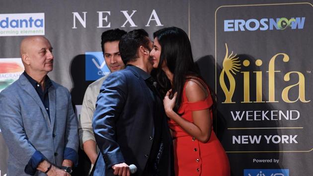 Bollywood actor Salman Khangreets actress Katrina Kaif as Anupam Kher and Varun Dhawan look on. (AFP)