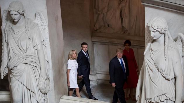 Emmanuel Macron (2nd L) and his wife Brigitte (L) tour Napoleon's Tomb with Donald Trump (2nd R) and Melania Trump (R) at Les Invalides museum in Paris, France. Touring the location Trump segued from to speaking on France’s rich cultural heritage and remarked to Brigitte Macron, ‘You’re in such good shape.’ (Ian Langsdon / Reuters) Emmanuel Macron (2nd L) and his wife Brigitte (L) tour Napoleon's Tomb with Donald Trump (2nd R) and Melania Trump (R) at Les Invalides museum in Paris, France. Touring the location Trump segued from to speaking on France’s rich cultural heritage and remarked to Brigitte Macron, ‘You’re in such good shape.’ (Ian Langsdon / Reuters)