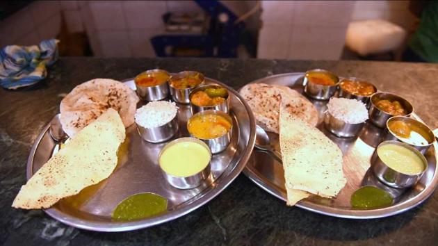 The dal, served in a bowl, is the crown of the thhali which comes with five little bowls.(HT Photo)