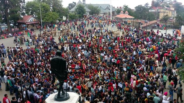 Locals protest at ridge near the statue of Mahatma Gandhi in Shimla on Saturday. (Deepak Sansta/HT Photo) Locals protest at ridge near the statue of Mahatma Gandhi in Shimla on Saturday. (Deepak Sansta/HT Photo)