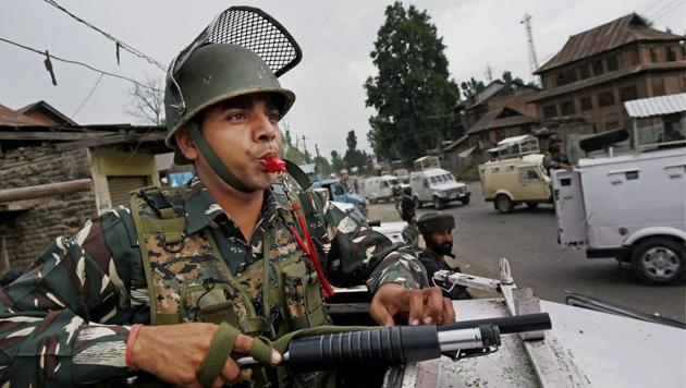 Security personnel keep vigil at the site of the recent militant attack on Amarnath Yatris, in which seven pilgrims were killed and 19 others injured, at Batango in Anantnag district.(PTI photo)