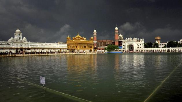 A scintillating view of the Golden Temple with clouds hovering over bringing in the possibility of rain in Amritsar. (PTI) A scintillating view of the Golden Temple with clouds hovering over bringing in the possibility of rain in Amritsar. (PTI)