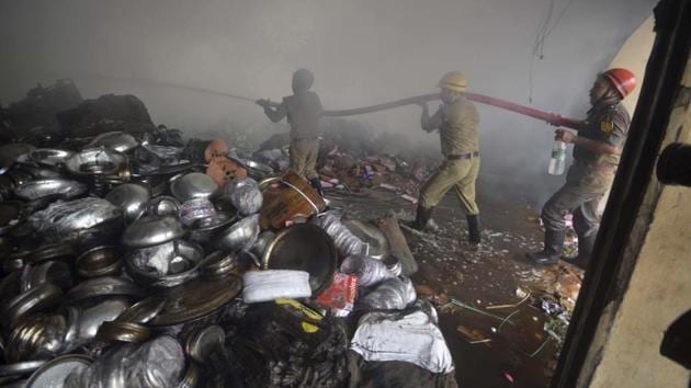 Firefighters extinguish fire at an electronic warehouse at Badharghat in Agartala. The warehouse caught fire due to a short circuit. (PTI) Firefighters extinguish fire at an electronic warehouse at Badharghat in Agartala. The warehouse caught fire due to a short circuit. (PTI)