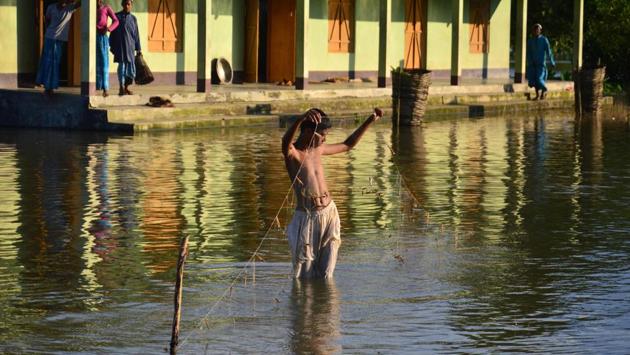 A student uses a traditional fishing net in front of the Jamlai Senior Madrasa School at Jamlai village in Kamrup district in Assam. (AFP) A student uses a traditional fishing net in front of the Jamlai Senior Madrasa School at Jamlai village in Kamrup district in Assam. (AFP)