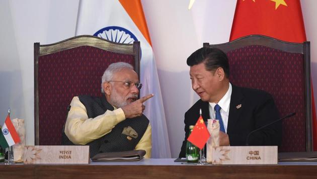 Prime Minister Narendra Modi with China's President Xi Jinping during a BRICS meeting, Goa, October 16, 2016(AFP)